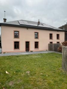 a house with solar panels on the roof at l'oiseau bleu in Rochehaut