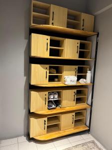 a closet with wooden shelves in a room at Hostel Samui in Nathon Bay