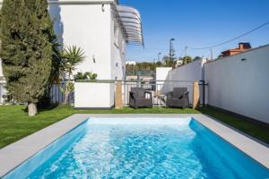 a swimming pool in the backyard of a house at Monte Tulum in Torrent