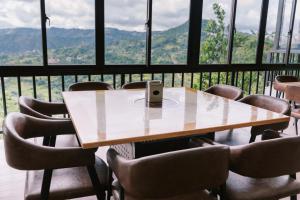 a table with a phone sitting on top of it at Serenity Busay Room 3 in Cebu City