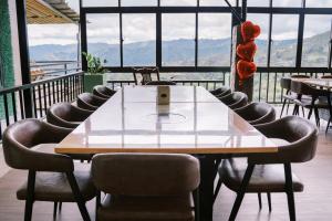 a table and chairs in a room with a view at Serenity Busay Room 3 in Cebu City
