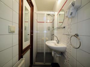 a bathroom with a sink and a shower at Hotelboat Sarah in Amsterdam +37 photos