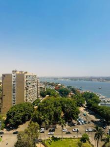 an aerial view of a city with a parking lot at VESTA Nile View Residence - Maadi in Cairo