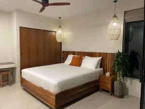 a bedroom with a bed and pendant lights at Altura Villa Pool & Panoramic View in Ban Nong Chaeng +11 photos
