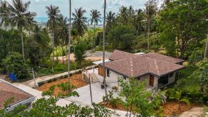 an aerial view of a house with palm trees at Altura Villa Pool & Panoramic View in Ban Nong Chaeng
