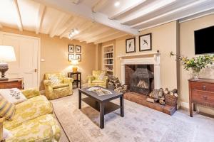 a living room with a fireplace and a tv at Finest Retreats - Dolhyfryd Lodge in Denbigh