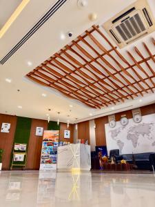 a room with a map of the world on the wall at Smana Hotel Al Raffa in Dubai +74 photos