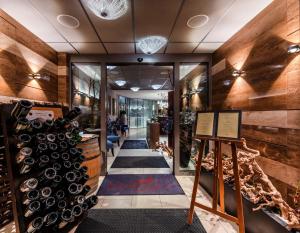 a wine store with a bunch of wine bottles at Anenské terasy in Brno