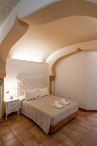 a bedroom with a large bed in a room at Hotel Kazar in Ontinyent