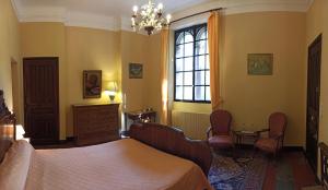 a bedroom with a bed and a window at CHÂTEAU CAGNINACCI B&B in San-Martino-di-Lota +21 photos