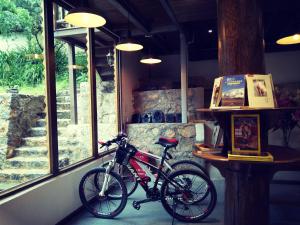 a bike parked in front of a window at Shangri-La mid - mountain homestay in Shangri-La