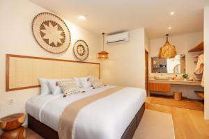 a bedroom with a large bed and a bathroom at Chaykha Retreat Phuket in Chalong +256 photos