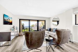 a living room with a couch and chairs at Santa Rosa Dunes 721 in Pensacola Beach