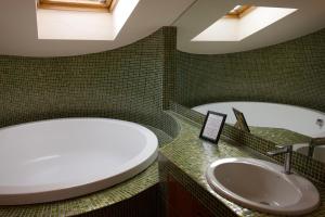 a bathroom with a tub and a sink at B & B Paradiso in Loreto +23 photos