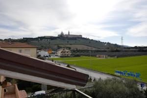 a hill with a castle on top of it at B & B Paradiso in Loreto