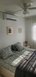 a bedroom with a bed and a ceiling at Sunny Hill Apartment in Ciudad Quesada