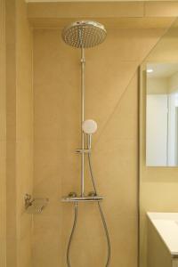 a shower with a shower head in a bathroom at Villa Artemis 1 - Etheras Properties in Kythira +43 photos