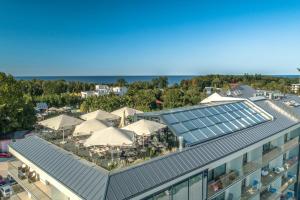 an overhead view of a building with tables and umbrellas at Imperiall Resort & MediSpa in Ustronie Morskie