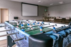 a group of toy people on a ping pong table at Imperiall Resort & MediSpa in Ustronie Morskie +59 photos