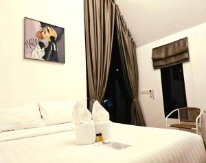a hotel room with a bed and a window at Nordic SkyBird Hill Chill in Pak Chong