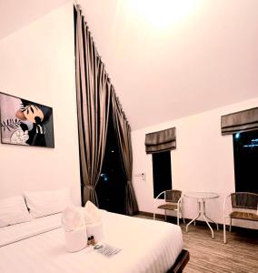 a room with a bed and a couch and a table at Nordic SkyBird Hill Chill in Pak Chong +14 photos