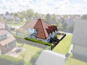 a model of a house with a roof at Vakantiewoning Nungesser Coli in Koksijde +5 photos