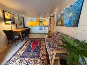 a living room with a couch and a table at Domaine Bellevie BnB in Vex
