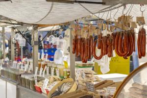 a bunch of sausages hanging in a market at Casa de Can Virolla Gran in Sa Pobla