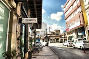 a street with a sign for a bookstore at Bedspot Heraklion in Heraklio