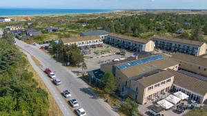 an aerial view of a town with a road and buildings at Feriecenter Slettestrand in Fjerritslev