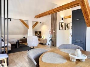 a living room with a wooden table and chairs at Apartman Romić in Vrlika