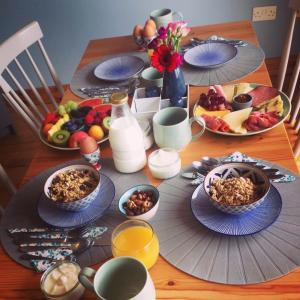 a table with plates and bowls of food on it at Ceol na dTonnta in Doolin +30 photos