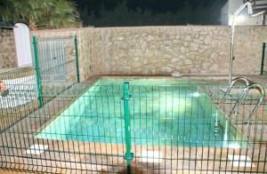 a swimming pool with a fence around it at Chalet El Palmar in El Palmar