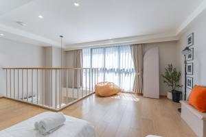 a living room with a bed and a large window at Heaven Thonglor 36 - Villa in Bangkok +89 photos