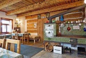 a kitchen with an old fashioned stove in a room at Chalupa U Kapličky Pastviny in Pastviny