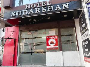 a hotel subazan sign on the front of a building at Hotel Sudarshan in Haridwār