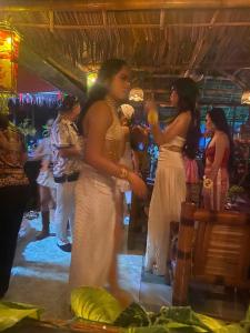 a group of women standing in a room at Satosa Beach Resort in San Joaquin