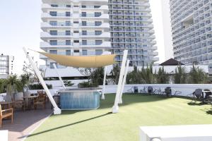 a hammock on the roof of a building at Kaiah's Haven at Azure North San Fernando Pampanga in San Fernando