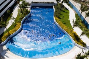 an aerial view of a water slide at a resort at Kaiah's Haven at Azure North San Fernando Pampanga in San Fernando +8 photos