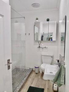 a white bathroom with a toilet and a sink at The Botanic High Gold in Paarl +33 photos