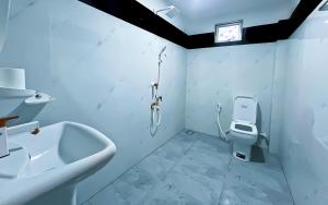 a bathroom with a shower and a toilet and a sink at Dan Sewana in Nochchiyagama +9 photos