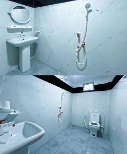 a bathroom with a sink and a shower and a toilet at Dan Sewana in Nochchiyagama
