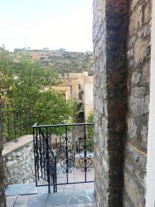 a balcony with a wrought iron railing on a building at Mimi's House 2 in Véssa