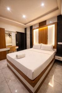 a bedroom with a large bed in a room at erode kongu mess in Chennai