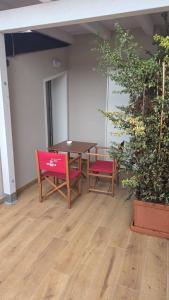 a table and two chairs in an empty room at Galé Suite Apartment in Chieti