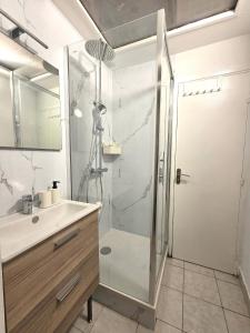 a bathroom with a shower and a sink at A l'orée de Croix - AbsoluteHome in Croix