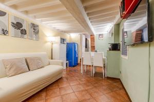 a living room with a couch and a table at Charming Mezzanino in Siena