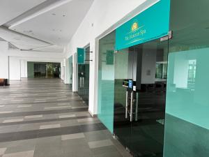 an empty hallway in a building with a blue sign at Swiss Cozy Studio Kuantan City View Imperium Residence in Kuantan