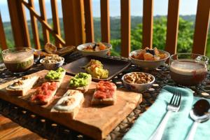 a table topped with different types of food and bowls of food at el balcon camiguin in Mambajao