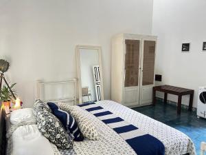 a bedroom with a bed with pillows on it at Crepe Ginger Home Stays in Hariharpur